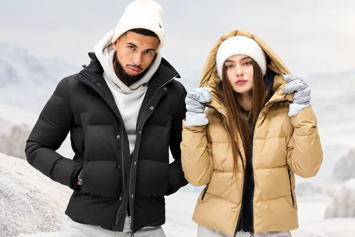 Person checking the shoulder seam and sleeve length of a winter jacket