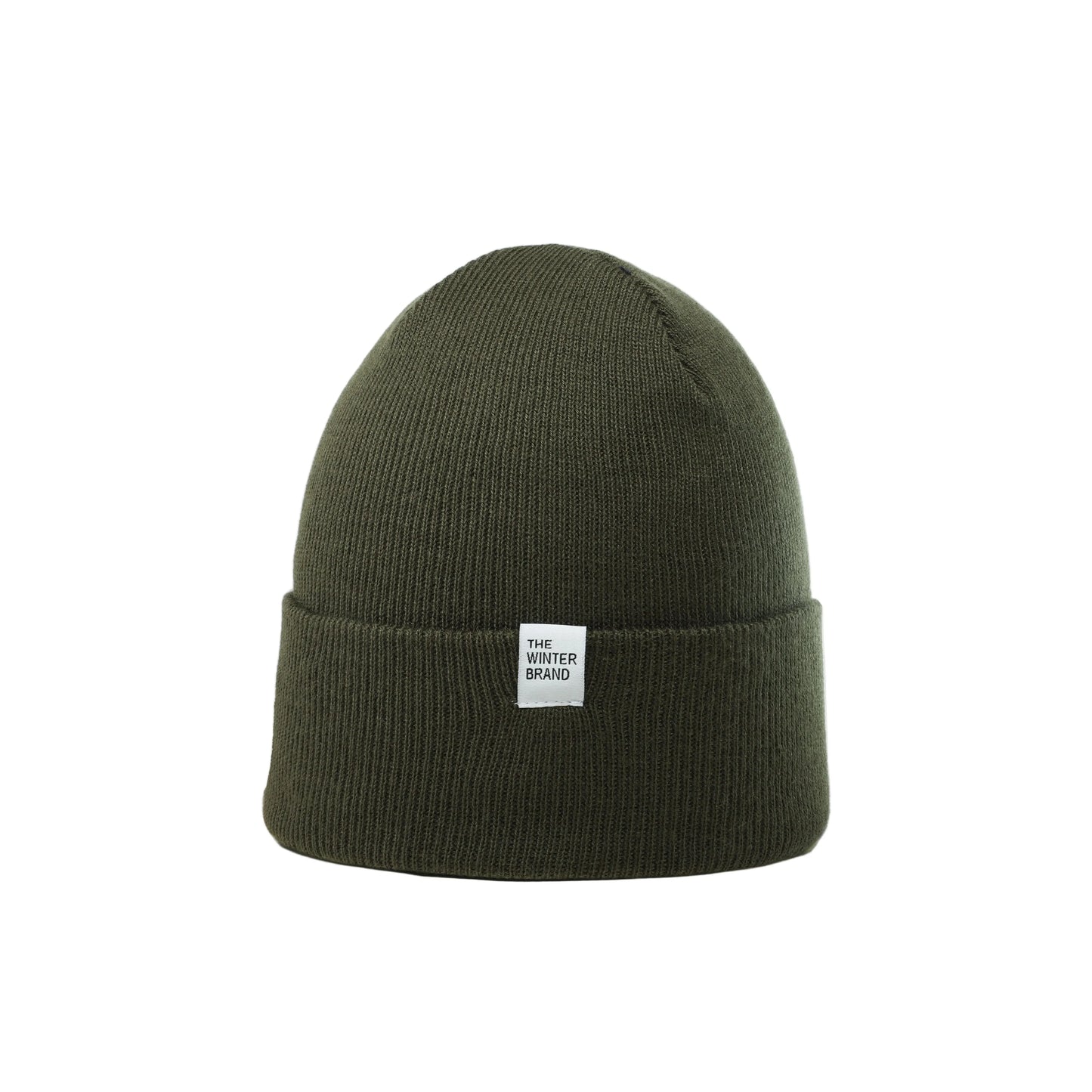 Green beanie with a white label on a white background